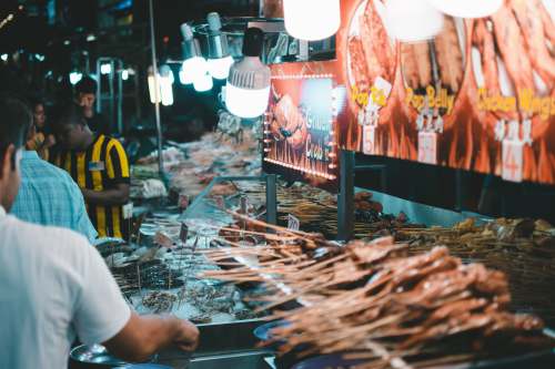 kuala lumpur people standing near food stall malaysia
